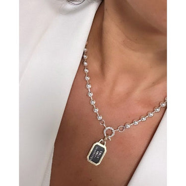 Envelope pendant with a big disc chain